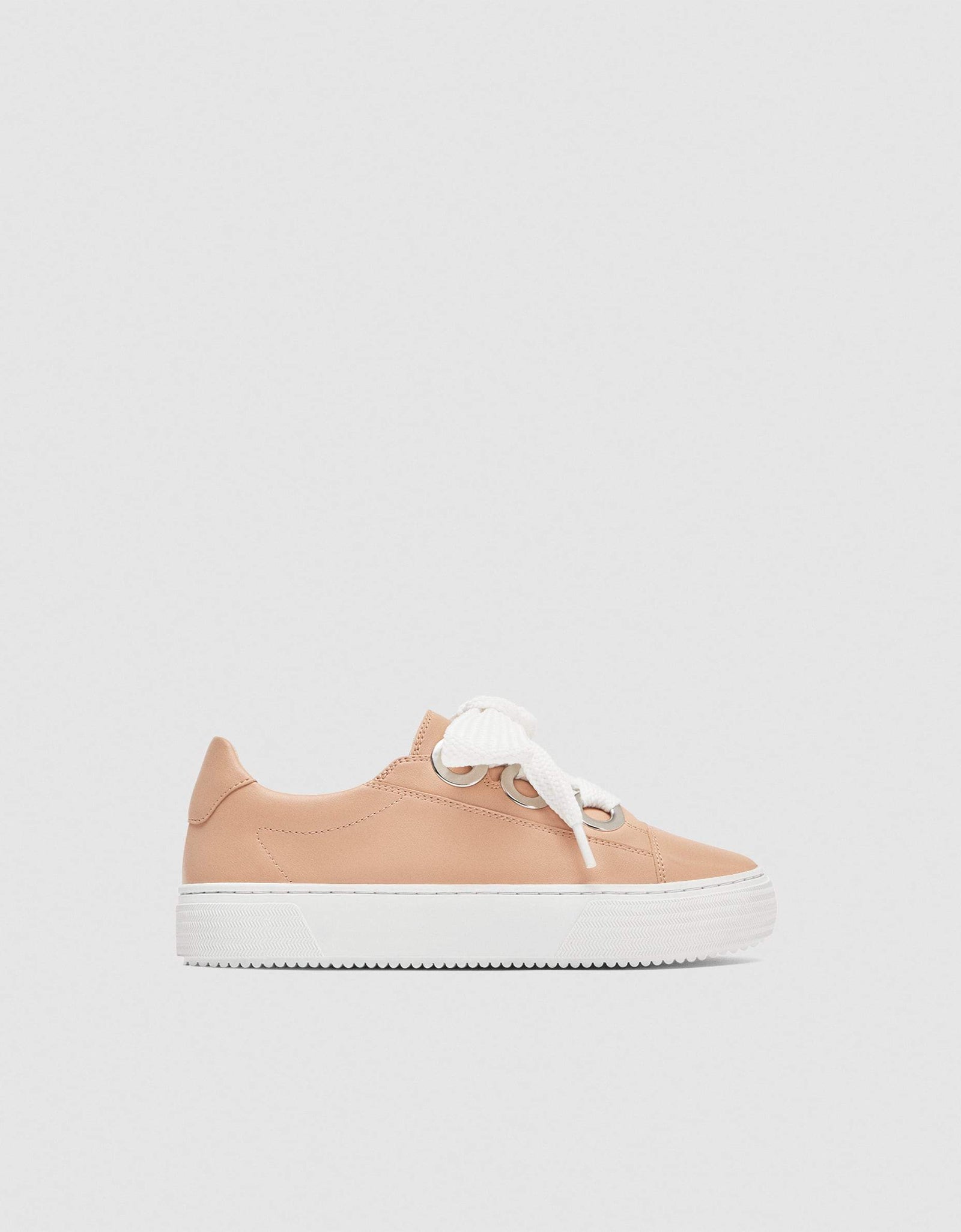 Sneakers with gromets details